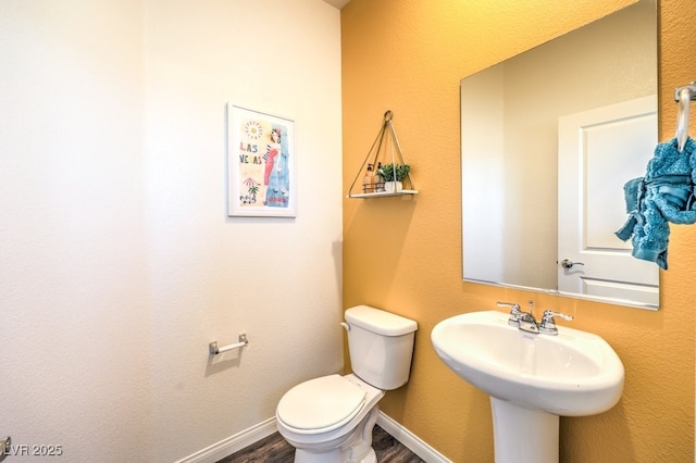 6521 Cinnamon Hazelnut St Lot 91, North Las Vegas, NV 89084 - half bath featuring toilet, wood finished floors, a sink, and baseboards