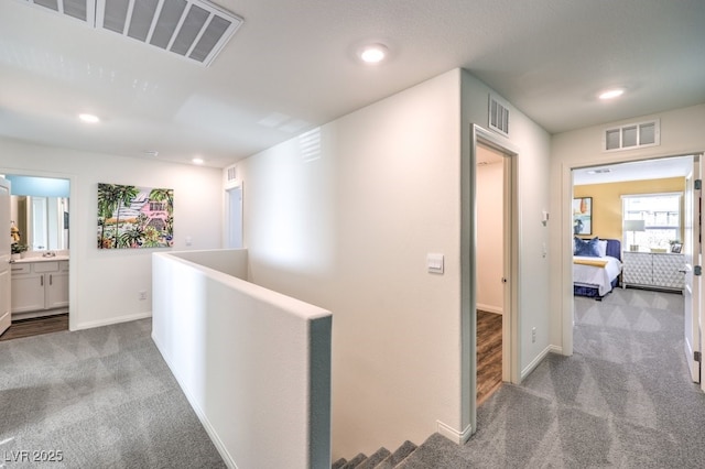 6521 Cinnamon Hazelnut St Lot 91, North Las Vegas, NV 89084 - corridor featuring carpet floors, an upstairs landing, recessed lighting, and baseboards
