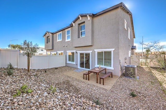 6521 Cinnamon Hazelnut St Lot 91, North Las Vegas, NV 89084 - back of property with a fenced backyard, stucco siding, central air condition unit, and a patio