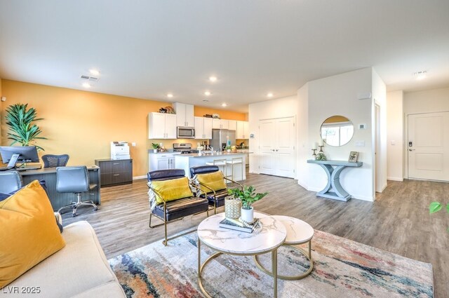 6521 Cinnamon Hazelnut St Lot 91, North Las Vegas, NV 89084 - living room featuring light wood-style floors, recessed lighting, an office area, and baseboards
