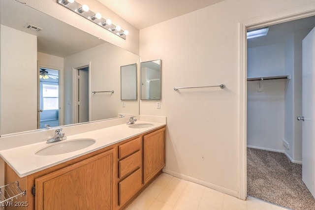 11177 Deluna St, Las Vegas, NV 89141 - full bath featuring double vanity, baseboards, and a walk in closet