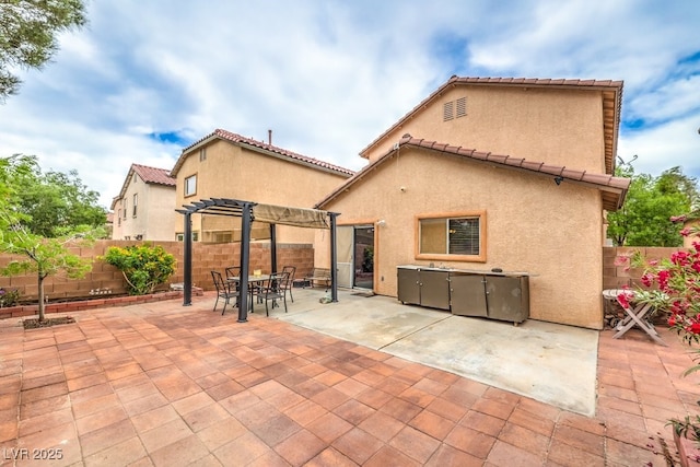 11177 Deluna St, Las Vegas, NV 89141 - back of property featuring a pergola, stucco siding, and a fenced backyard