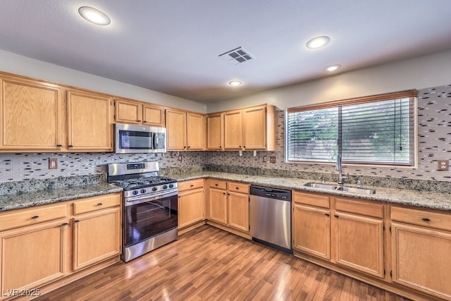 11177 Deluna St, Las Vegas, NV 89141 - kitchen featuring appliances with stainless steel finishes, a sink, tasteful backsplash, and recessed lighting