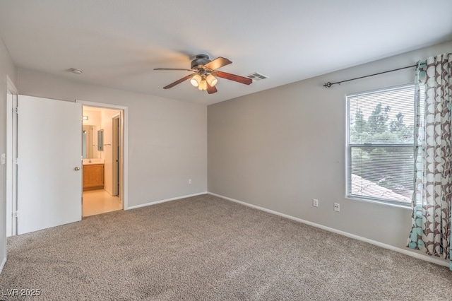 11177 Deluna St, Las Vegas, NV 89141 - unfurnished bedroom featuring carpet flooring, baseboards, a ceiling fan, and ensuite bathroom