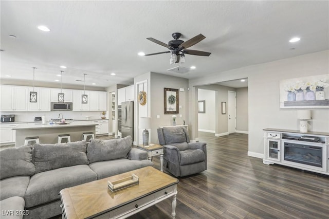 716 Cadence View Way, Henderson, NV 89011 - living area with baseboards, recessed lighting, dark wood-style floors, and a ceiling fan
