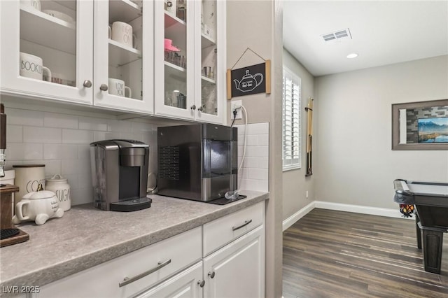 716 Cadence View Way, Henderson, NV 89011 - kitchen featuring decorative backsplash, dark wood-style floors, white cabinets, and light countertops