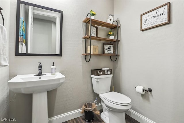 716 Cadence View Way, Henderson, NV 89011 - half bathroom featuring toilet, wood finished floors, and baseboards