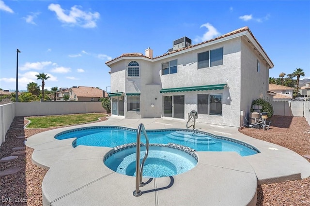 3604 N Campbell Rd, Las Vegas, NV 89129 - view of swimming pool featuring a patio area, a fenced backyard, a pool with connected hot tub, and central AC