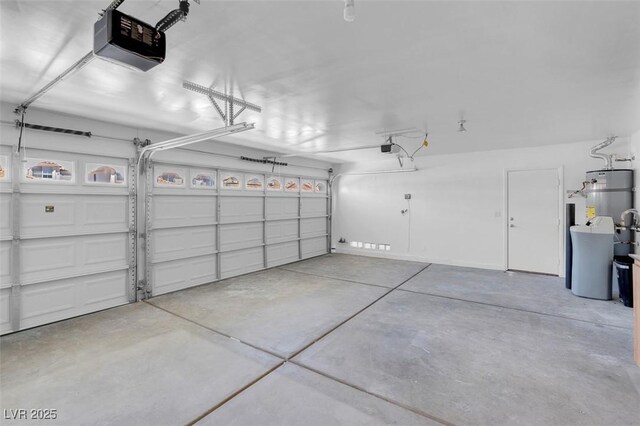 3604 N Campbell Rd, Las Vegas, NV 89129 - garage with a garage door opener and secured water heater