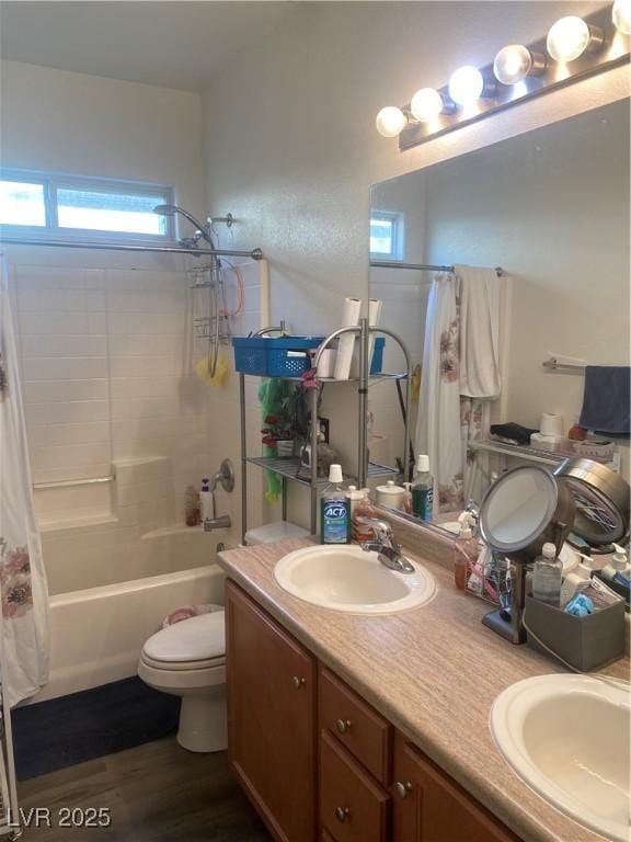 8913 Cambridge Glen Ct, Las Vegas, NV 89149 - full bath featuring shower / bath combo, double vanity, toilet, and wood finished floors