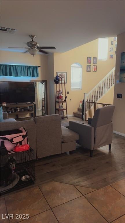8913 Cambridge Glen Ct, Las Vegas, NV 89149 - tiled living room featuring stairs, ceiling fan, and baseboards