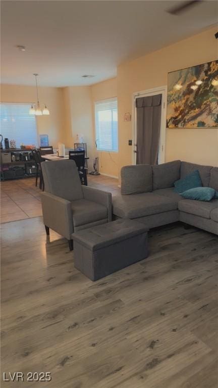 8913 Cambridge Glen Ct, Las Vegas, NV 89149 - living area featuring a chandelier and wood finished floors