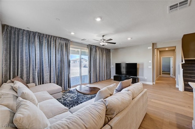 7572 Mount Spokane Ct, Las Vegas, NV 89113 - living area with light wood finished floors, stairs, a ceiling fan, baseboards, and recessed lighting