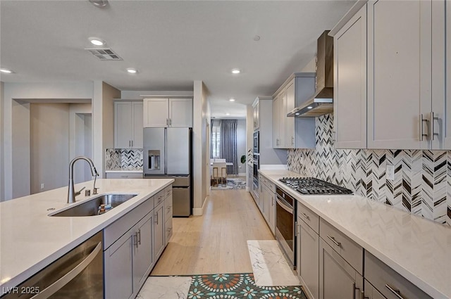 7572 Mount Spokane Ct, Las Vegas, NV 89113 - kitchen featuring a sink, appliances with stainless steel finishes, wall chimney exhaust hood, gray cabinets, and recessed lighting
