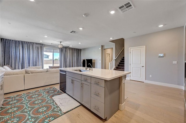 7572 Mount Spokane Ct, Las Vegas, NV 89113 - kitchen with a sink, gray cabinets, light wood-type flooring, open floor plan, and recessed lighting