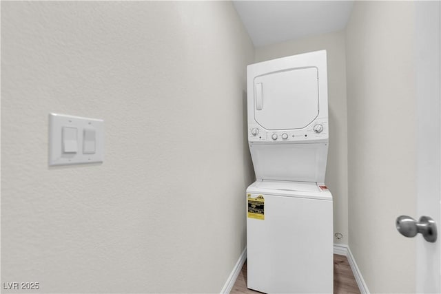 952 Balzar Ave, Las Vegas, NV 89106 - washroom featuring stacked washer / drying machine, wood finished floors, and baseboards