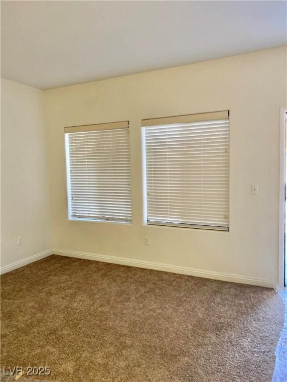 2121 Hussium Hills St Unit 107, Las Vegas, NV 89108 - spare room featuring carpet flooring and baseboards