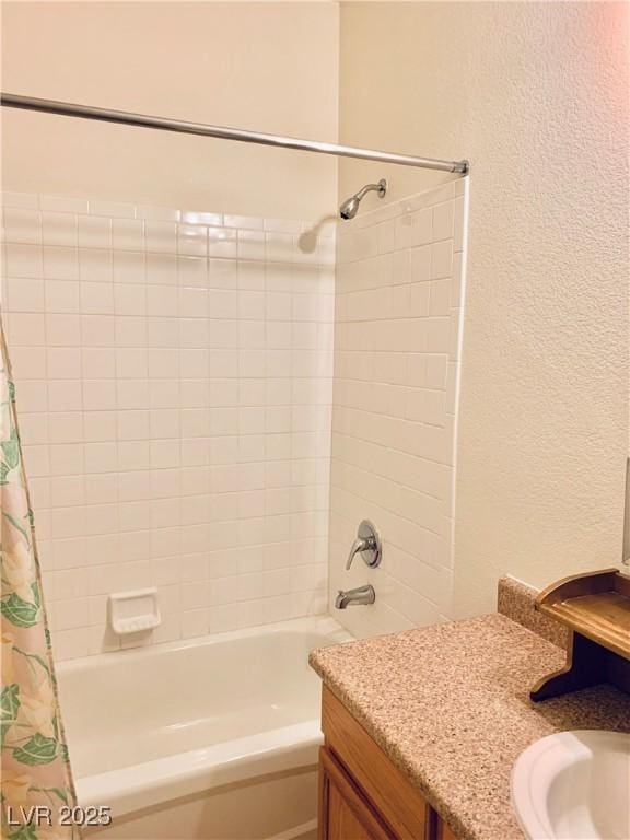 2121 Hussium Hills St Unit 107, Las Vegas, NV 89108 - full bathroom featuring shower / tub combo with curtain, a textured wall, and vanity