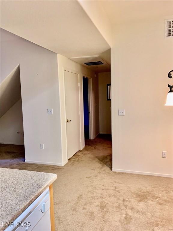 2121 Hussium Hills St Unit 107, Las Vegas, NV 89108 - unfurnished room featuring light colored carpet and baseboards