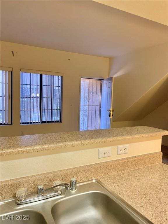 2121 Hussium Hills St Unit 107, Las Vegas, NV 89108 - kitchen view of a sink and light countertops