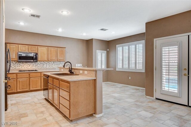 10608 Trussell St, Las Vegas, NV 89141 - kitchen featuring stainless steel appliances, light countertops, light stone finish flooring, backsplash, and recessed lighting