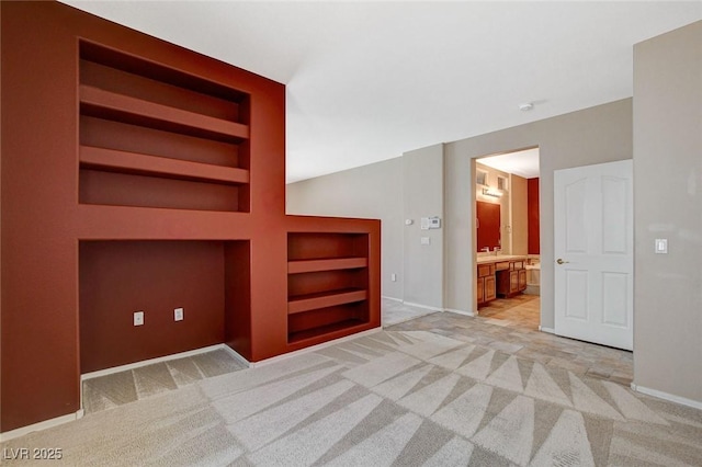 10608 Trussell St, Las Vegas, NV 89141 - spare room featuring built in shelves and light colored carpet