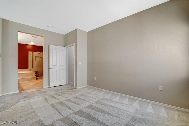10608 Trussell St, Las Vegas, NV 89141 - unfurnished bedroom featuring light carpet and ensuite bathroom