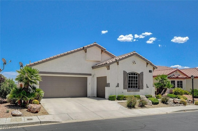 10608 Trussell St, Las Vegas, NV 89141 - mediterranean / spanish-style home featuring an attached garage, stucco siding, concrete driveway, and a tiled roof
