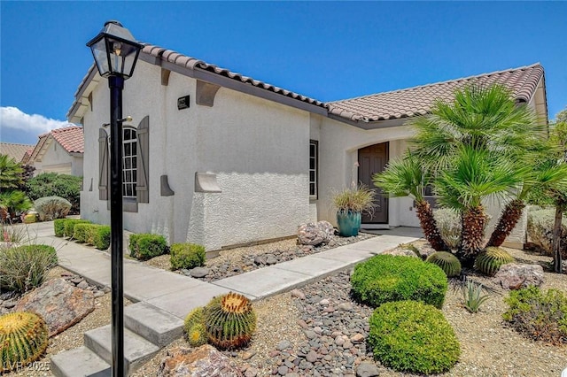 10608 Trussell St, Las Vegas, NV 89141 - view of front of house featuring a tiled roof and stucco siding