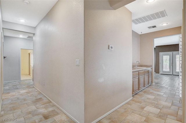 10608 Trussell St, Las Vegas, NV 89141 - corridor with stone tile floors and baseboards