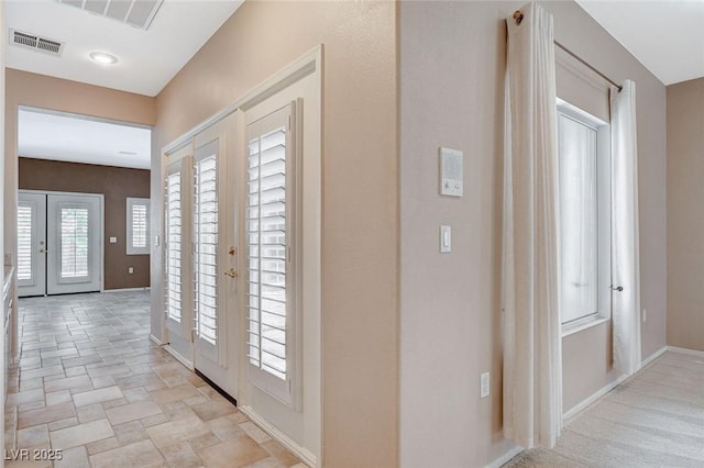 10608 Trussell St, Las Vegas, NV 89141 - entryway featuring french doors and light stone finish floors