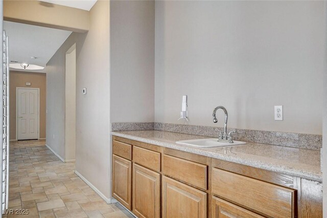 10608 Trussell St, Las Vegas, NV 89141 - bar area featuring a sink and stone finish floors