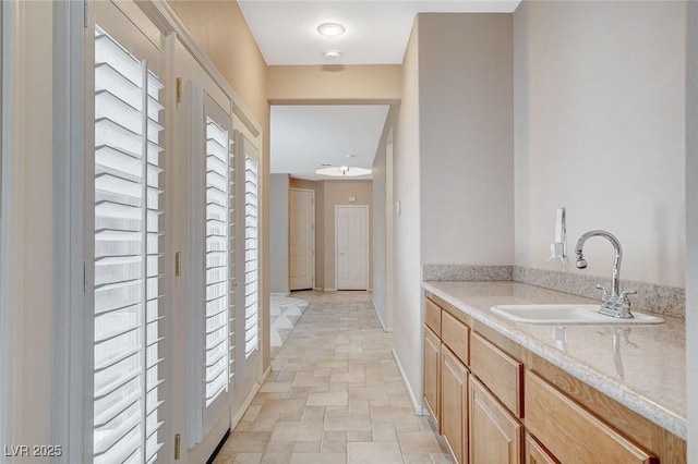 10608 Trussell St, Las Vegas, NV 89141 - hallway with a sink and stone finish floors