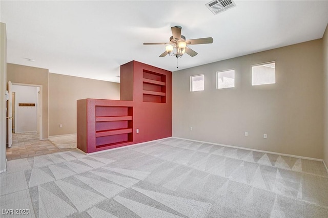 10608 Trussell St, Las Vegas, NV 89141 - empty room with light colored carpet, a ceiling fan, and built in shelves