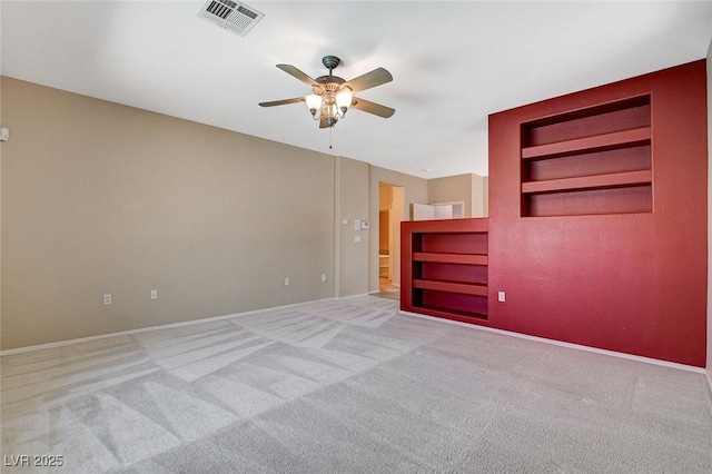 10608 Trussell St, Las Vegas, NV 89141 - carpeted spare room featuring a ceiling fan and built in shelves