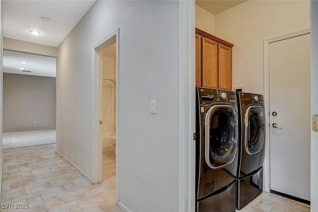 10608 Trussell St, Las Vegas, NV 89141 - washroom with cabinet space and washer and clothes dryer