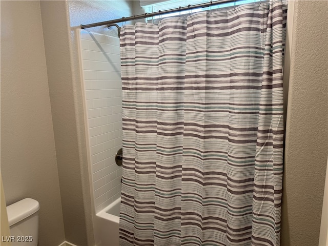 7855 Skyler Falls Ln, North Las Vegas, NV 89084 - full bathroom with toilet, shower / bath combo, and a textured wall