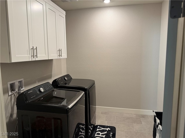 7855 Skyler Falls Ln, North Las Vegas, NV 89084 - washroom featuring separate washer and dryer, cabinet space, and tile patterned flooring