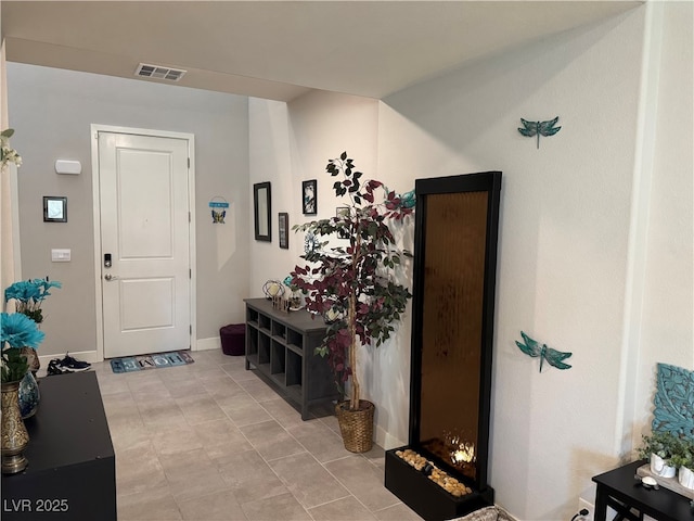 7855 Skyler Falls Ln, North Las Vegas, NV 89084 - entryway with baseboards and light tile patterned floors