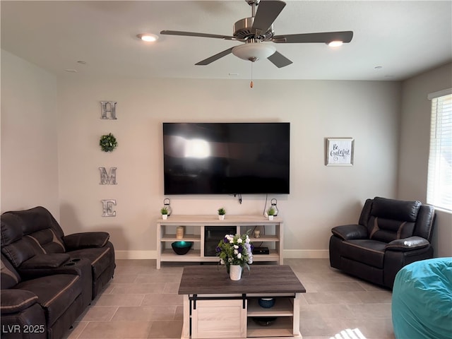 7855 Skyler Falls Ln, North Las Vegas, NV 89084 - living room with a ceiling fan, light tile patterned floors, and baseboards