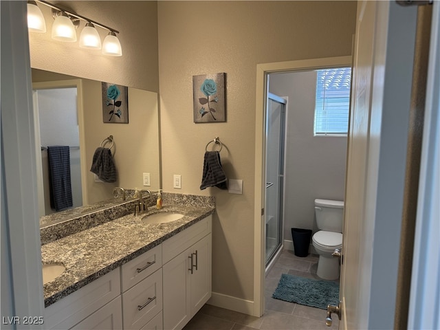 7855 Skyler Falls Ln, North Las Vegas, NV 89084 - full bath with toilet, a shower stall, double vanity, and tile patterned floors