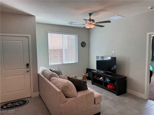 7855 Skyler Falls Ln, North Las Vegas, NV 89084 - living room with a ceiling fan, light tile patterned floors, and baseboards