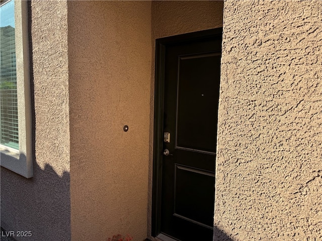 7855 Skyler Falls Ln, North Las Vegas, NV 89084 - entrance to property featuring stucco siding