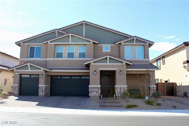 7855 Skyler Falls Ln, North Las Vegas, NV 89084 - craftsman inspired home with stone siding, an attached garage, stucco siding, and driveway