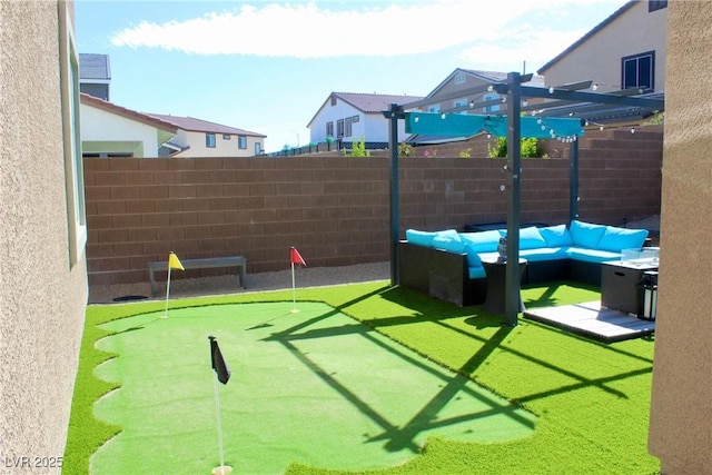 7855 Skyler Falls Ln, North Las Vegas, NV 89084 - view of yard featuring an area to practice putting and a pergola