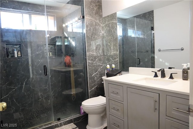 1482 Flintrock Rd, Henderson, NV 89014 - bathroom featuring vanity, toilet, a marble finish shower, and tile walls