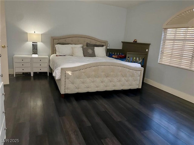 1482 Flintrock Rd, Henderson, NV 89014 - bedroom with dark wood-style floors and baseboards