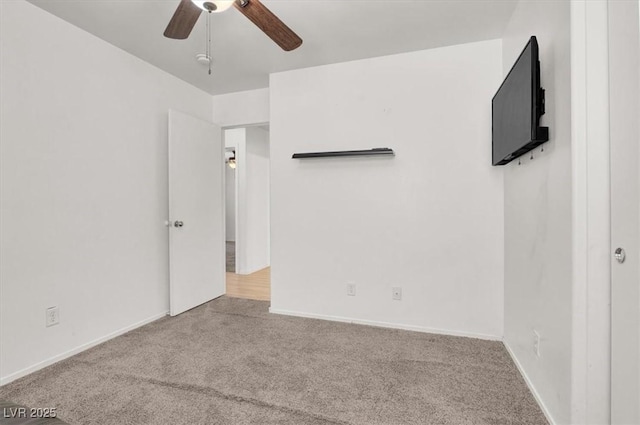 6581 Netherseal Ave, Las Vegas, NV 89139 - unfurnished bedroom featuring carpet, ceiling fan, and baseboards