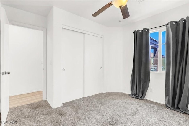 6581 Netherseal Ave, Las Vegas, NV 89139 - unfurnished bedroom featuring carpet floors, a closet, a ceiling fan, and baseboards