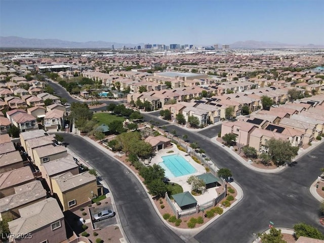 6581 Netherseal Ave, Las Vegas, NV 89139 - aerial view of property's location with a mountainous background, a pool area, and nearby suburban area